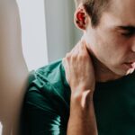 0_Conceptual-image-of-a-man-holding-his-neck-either-in-physical-or-emotional-pain.jpg