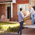 0_Couple-Unpacking-Moving-In-Boxes-From-Removal-Truck.jpg