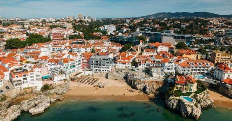 0_Drone-aerial-view-of-unidentifiable-sunbathers-at-Praia-da-Rainha-beach-in-Cascais-Portugal.jpg