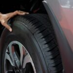 0_Hand-man-checking-air-pressure-air-car-tire-Image.jpg