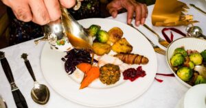 0_Man-pouring-gravy-over-Christmas-dinner-plate.jpg
