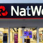 0_Modern-NatWest-bank-exterior-with-illuminated-logo-and-glass-entrance-at-night.jpg