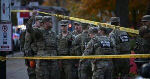 0_National-Guard-soldiers-stand-behind-the-crime-scene-in-Washington-DC.jpg