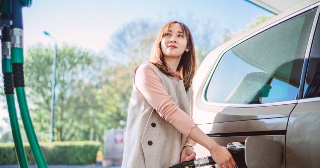 0_Woman-refueling-her-car-at-a-gas-station-on-a-sunny-day.jpg