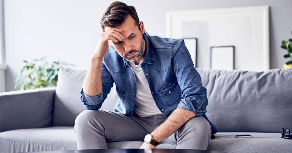 0_Worried-thoughtful-man-sitting-on-sofa.jpg