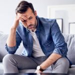 0_Worried-thoughtful-man-sitting-on-sofa.jpg