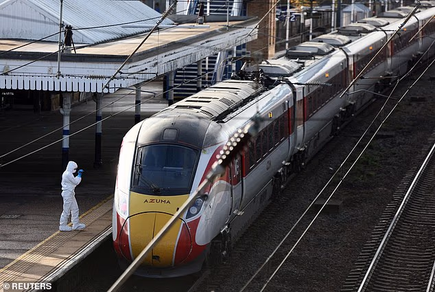 103722841-15295581-A_forensic_officer_inspects_the_London_North_Eastern_Railway_LNE-a-4_176328443930.avif