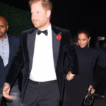 103723923-15279721-Prince_Harry_held_Meghan_s_hand_as_he_led_her_into_the_lavish_Ja-a-33_17628645557.avif