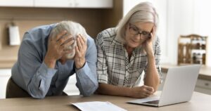 1_Elderly-couple-upset-looking-at-their-finances.jpg