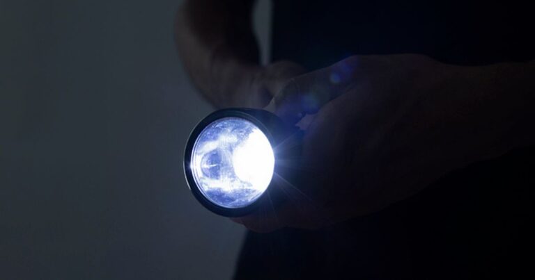 1_Unrecognizable-male-holding-a-flashlight.jpg