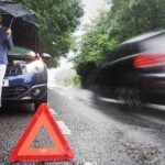 1_Woman-on-side-of-road-with-broken-down-car-in-the-rain.jpg