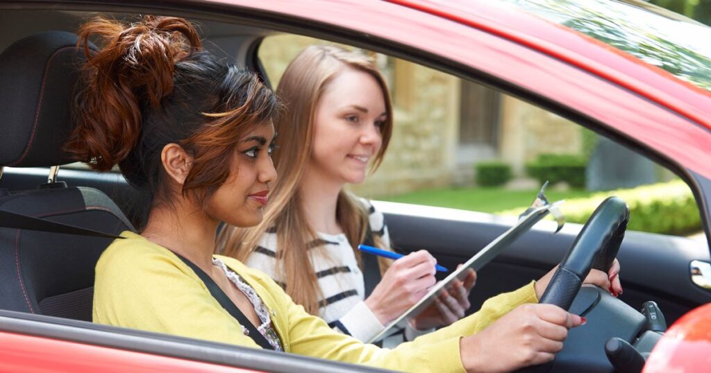 1_Young-Woman-Having-Driving-Lesson-With-Female-Instructor.jpg