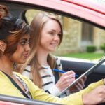 1_Young-Woman-Having-Driving-Lesson-With-Female-Instructor.jpg