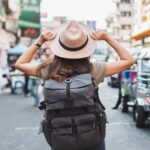 2_Back-view-Asian-woman-tourist-backpacker-travel-in-Khao-San-road-Bangkok-Thailand.jpg