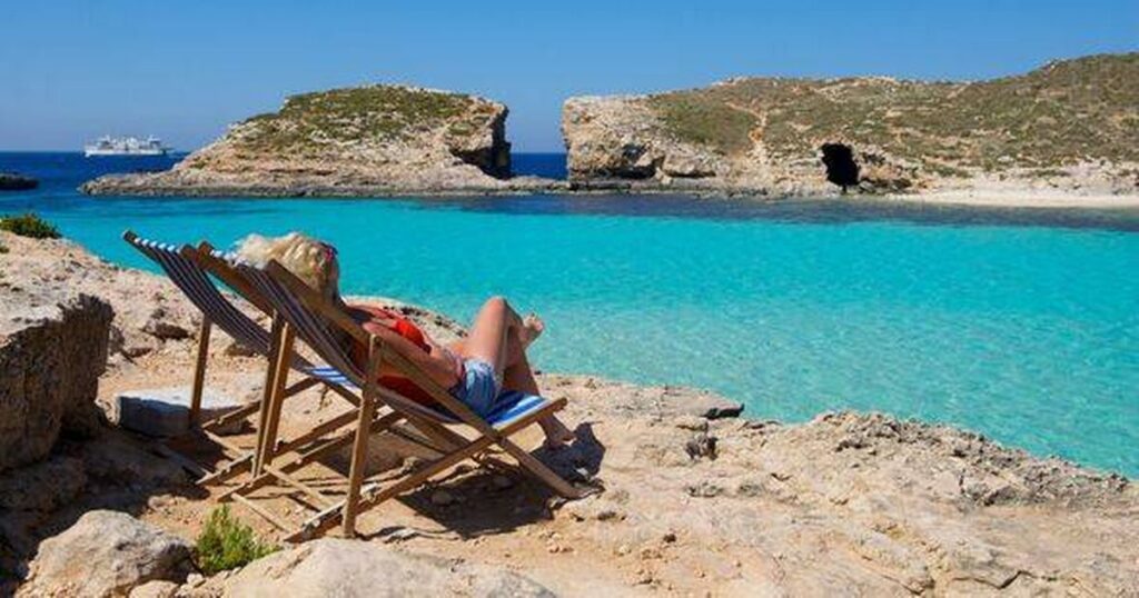 2_Woman-sitting-in-deckchair-Comino-island-Malta.jpg