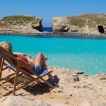 2_Woman-sitting-in-deckchair-Comino-island-Malta.jpg