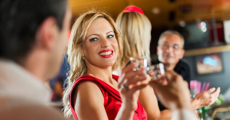 3_Smiling-woman-toasting-with-her-friend-in-a-bar.jpg
