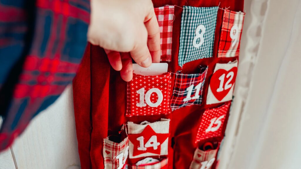 advent-calendar-preparing-christmas-hand-1040558979.jpg