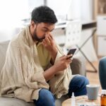 sick-young-indian-man-blanket-1039025985_673e72.jpg