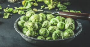 0_Bowl-with-raw-Brussels-sprouts-on-dark-rustic-table-with-ingredients.jpg