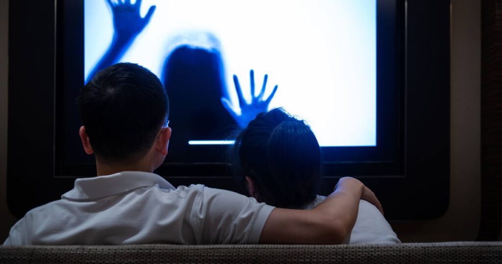 0_Couple-watching-horror-movie-in-living-room.jpg