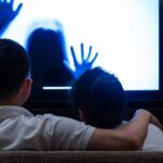 0_Couple-watching-horror-movie-in-living-room.jpg