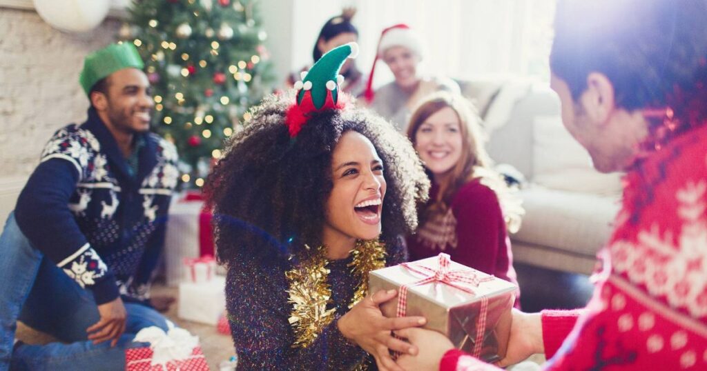 0_Enthusiastic-friends-exchanging-Christmas-gifts.jpg