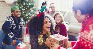 0_Enthusiastic-friends-exchanging-Christmas-gifts.jpg