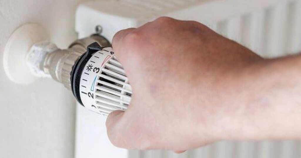 0_Human-hand-adjusts-thermostat-on-a-heater.jpg
