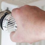 0_Human-hand-adjusts-thermostat-on-a-heater.jpg