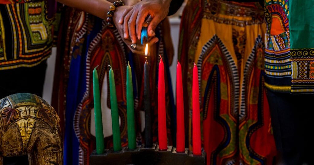 0_Kwanzaa-celebration-close-up-of-family-lighting-the-kinara-candle-in-spirit-of-unity.jpg