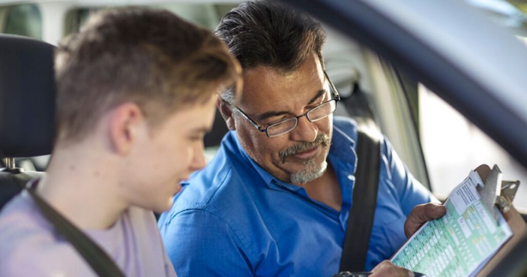 0_Learner-driver-with-instructor-in-car-looking-at-test-script.jpg
