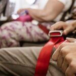 0_Plane-passenger-touching-their-seatbelt.jpg