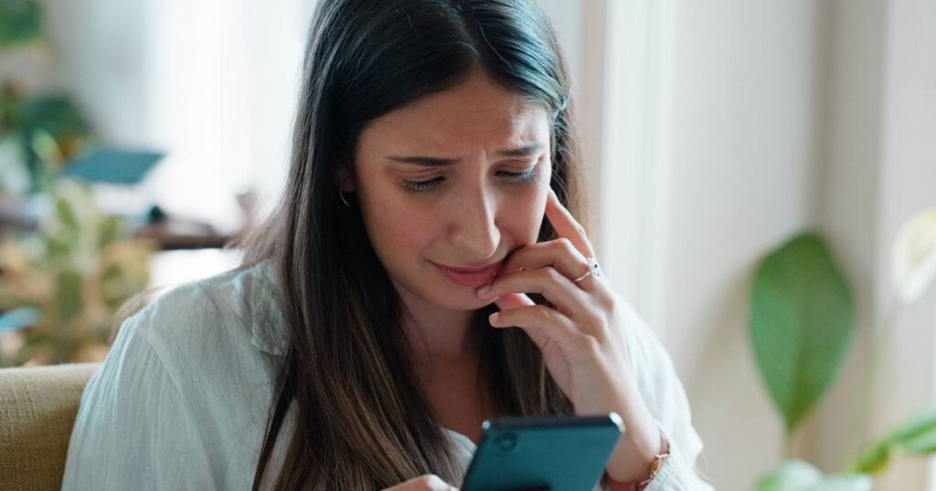 0_Sad-woman-phone-and-crying-with-bad-news-anxiety-or-stress-in-mental-health-or-burnout-at-home-Fa.jpeg