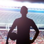 0_Silhouette-of-soccer-player-standing-in-stadium-with-a-ball.jpg