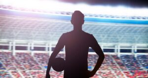 0_Silhouette-of-soccer-player-standing-in-stadium-with-a-ball.jpg