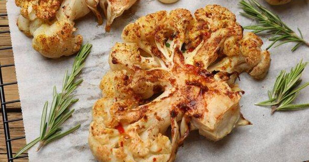 0_Tasty-cauliflower-steaks-rosemary-and-garlic-on-table-closeup.jpg