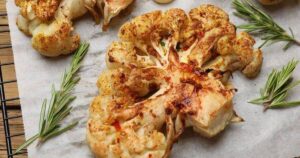 0_Tasty-cauliflower-steaks-rosemary-and-garlic-on-table-closeup.jpg