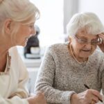 0_Woman-helping-her-elderly-mother-preparing-financial-documents.jpg