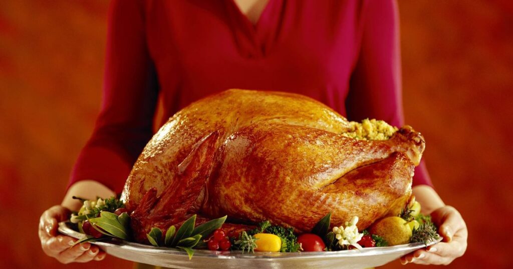 0_Woman-with-roast-turkey.jpg
