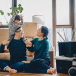 0_Young-Asian-family-sitting-on-the-floor-chatting-and-resting-while-unpacking-boxes-after-moving-in.jpeg