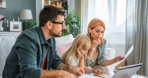0_Young-family-with-daughter-going-over-finances-at-home.jpg