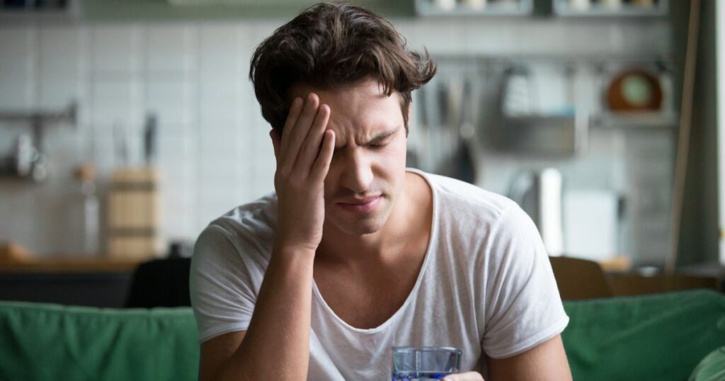 0_Young-man-suffering-from-headache-migraine-or-hangover-at-home.jpg