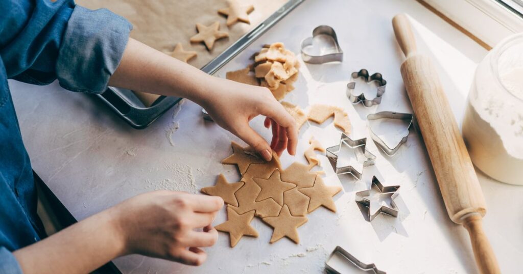 0_Young-woman-preparing-Christmas-cookies-on-table.jpg