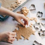 0_Young-woman-preparing-Christmas-cookies-on-table.jpg