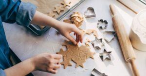 0_Young-woman-preparing-Christmas-cookies-on-table.jpg