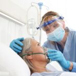 0_nurse-puts-oxygen-mask-on-elderly-woman-patient-lying-in-the-hospital-room-bed-wearing-protective.jpeg