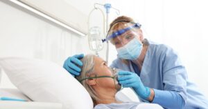 0_nurse-puts-oxygen-mask-on-elderly-woman-patient-lying-in-the-hospital-room-bed-wearing-protective.jpeg