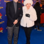 104318091-15340153-Dame_Joan_Collins_made_a_glamorous_entrance_alongside_her_husban-a-31_17645406109.avif