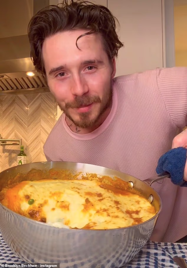 104858097-15397201-Brooklyn_Beckham_26_appeared_to_be_missing_British_cooking_as_he-a-37_17660889050.avif